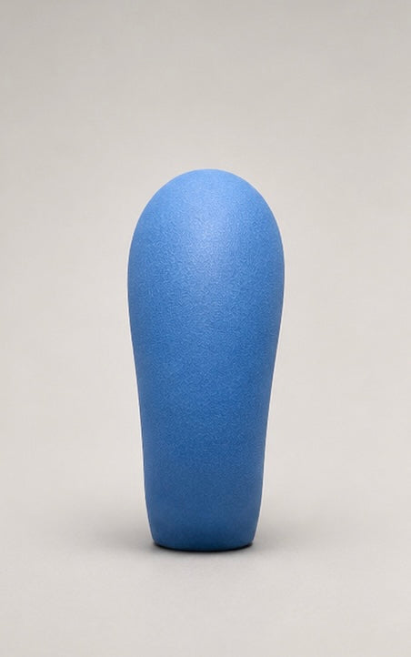 Blue curved foam puppet nose, front view