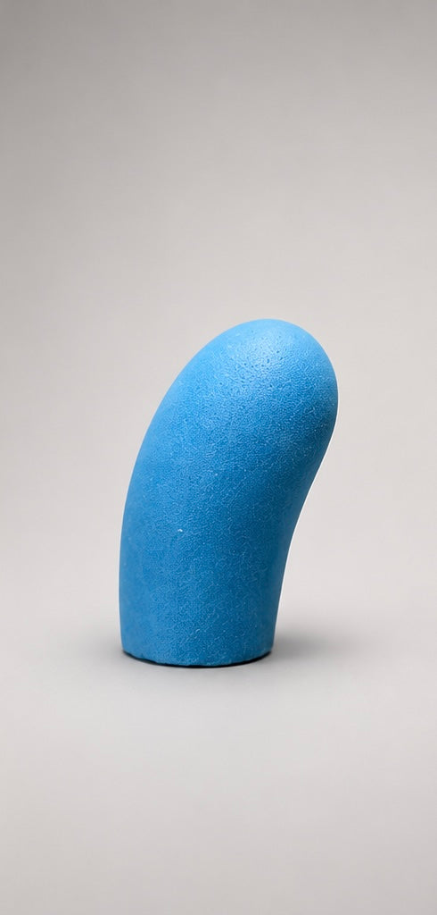 Blue upright curved foam puppet nose, side view